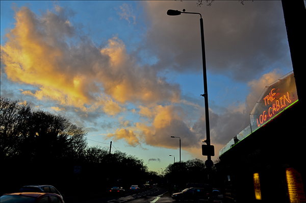 Â© Geoff Wilkinson, who writes on his Wanstead Daily Photo blog: "I was near Hollow Pond, Whipps Cross Road when the setting sun briefly lit up the clouds overhead . The Log Cabin cafe was close by and I spotted that the neon sign on the cafe was roughly the same colour as the illuminated part of the clouds. This for me made the picture."